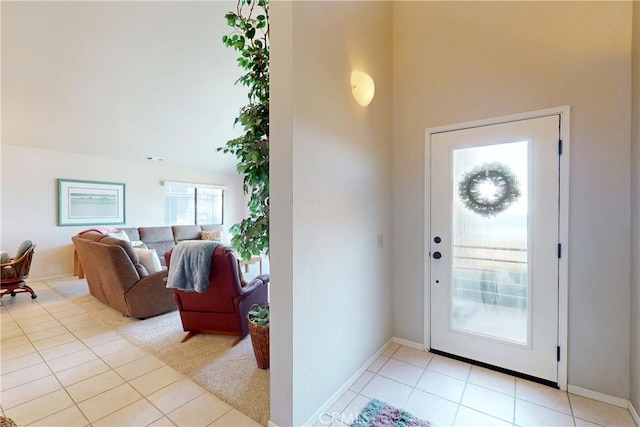 entryway featuring baseboards and light tile patterned floors