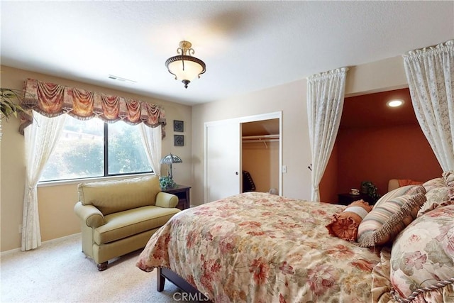 bedroom featuring baseboards, visible vents, and light carpet