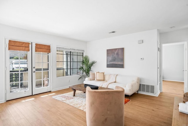 living room featuring light hardwood / wood-style flooring and plenty of natural light