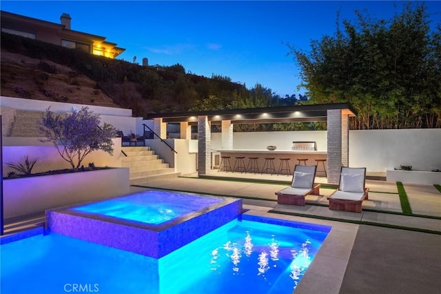 919 Sandcastle Dr, Corona Del Mar, CA 92625 - view of swimming pool with fence, outdoor dry bar, a patio area, stairs, and an in ground hot tub