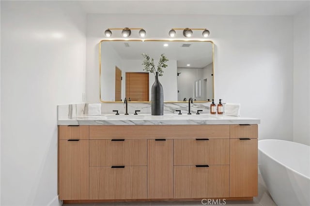 919 Sandcastle Dr, Corona Del Mar, CA 92625 - bathroom featuring a soaking tub, visible vents, a sink, and double vanity