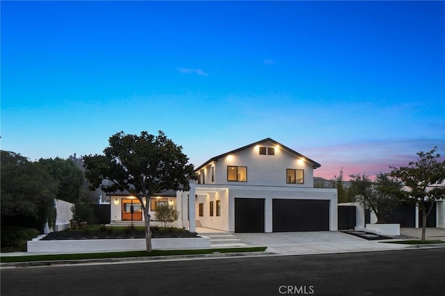 919 Sandcastle Dr, Corona Del Mar, CA 92625 - view of front of property with stucco siding, an attached garage, and concrete driveway