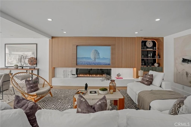 919 Sandcastle Dr, Corona Del Mar, CA 92625 - living area featuring wood finished floors, a glass covered fireplace, and recessed lighting