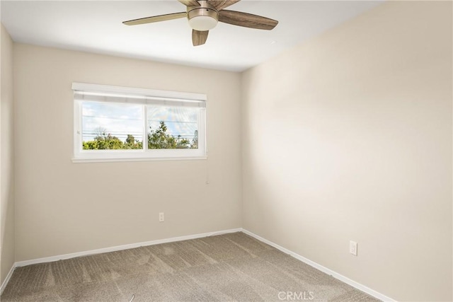 carpeted empty room featuring ceiling fan