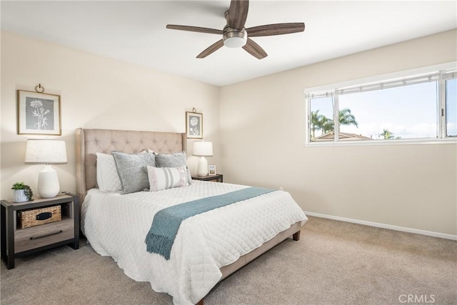 bedroom featuring light carpet and ceiling fan