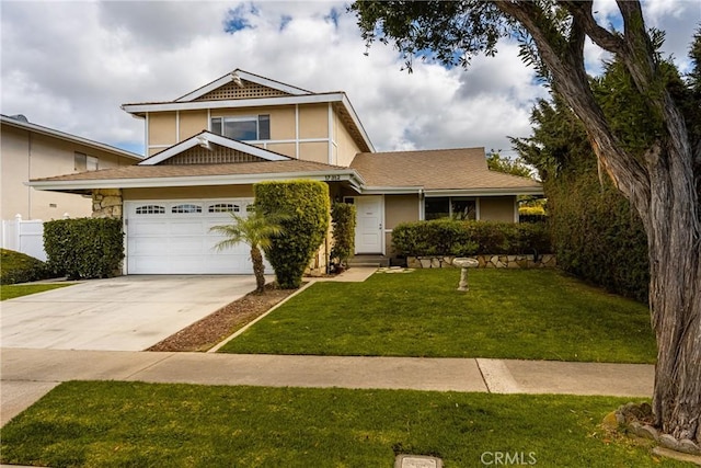 view of front of home featuring a garage and a front lawn