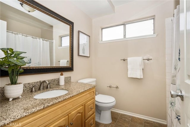 bathroom with a shower with curtain, vanity, toilet, and tile patterned flooring