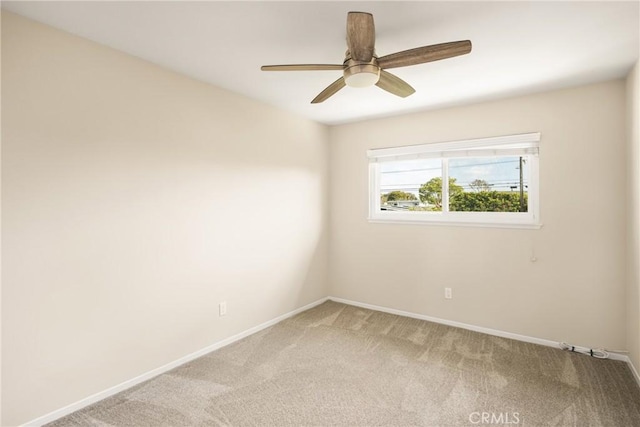 empty room with ceiling fan and carpet