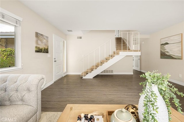 living room with dark wood-type flooring