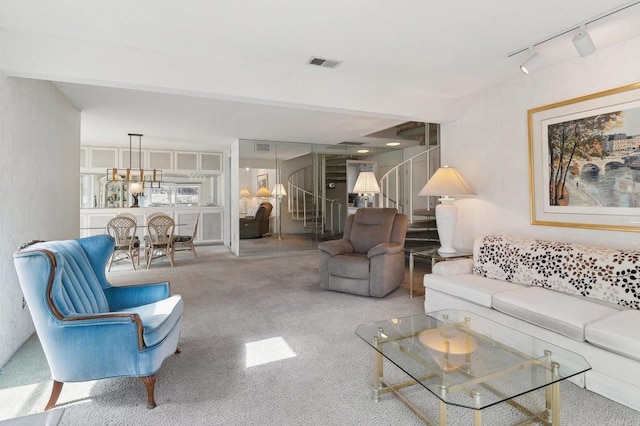 living room featuring track lighting and light carpet