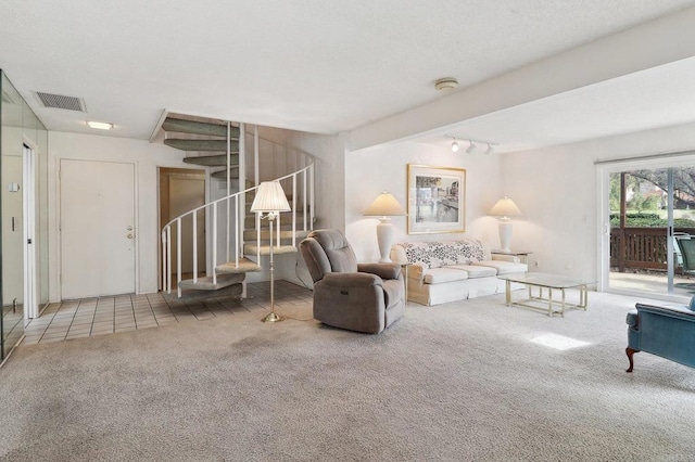 living room with carpet floors and track lighting