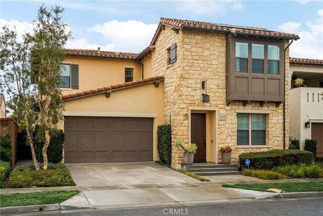 mediterranean / spanish-style house featuring a garage