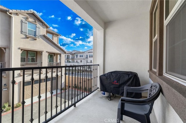 balcony featuring a grill and a residential view