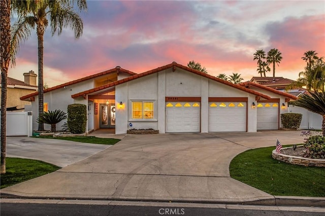 mediterranean / spanish-style house featuring a garage