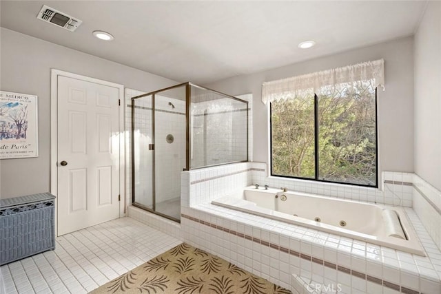 bathroom with visible vents, a stall shower, tile patterned flooring, and a jetted tub