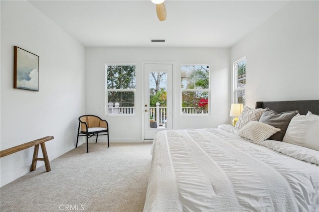 bedroom with light carpet, access to outside, and ceiling fan