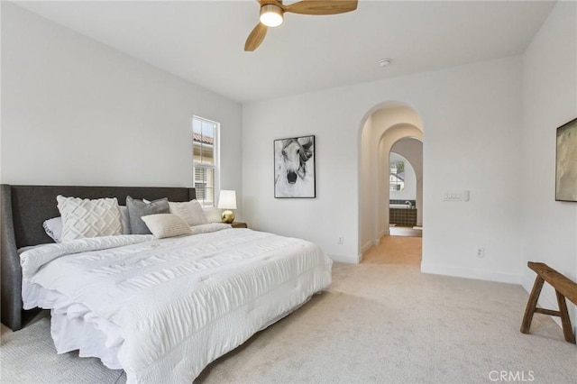 bedroom with light colored carpet and ceiling fan