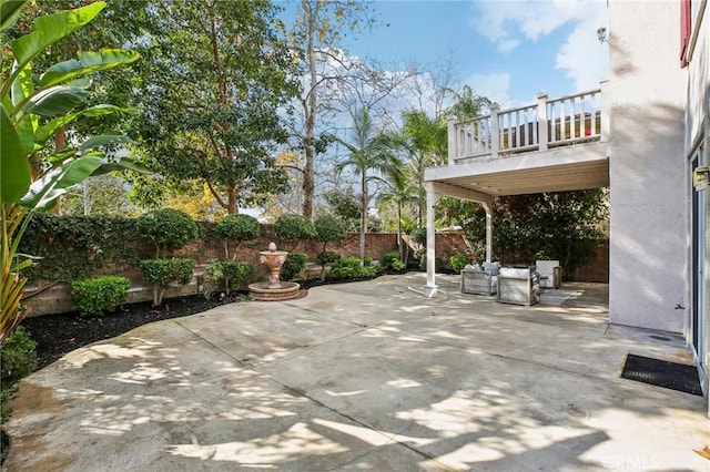 view of patio with a balcony