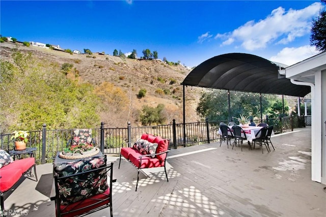 view of patio / terrace featuring an outdoor living space and a mountain view