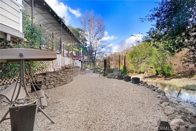 view of yard featuring a water view