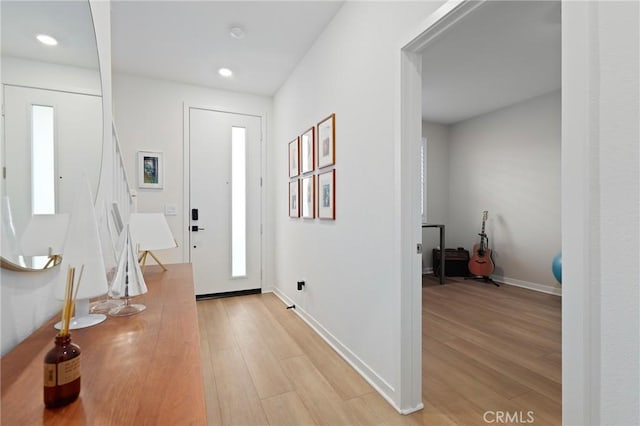 entryway with light hardwood / wood-style flooring