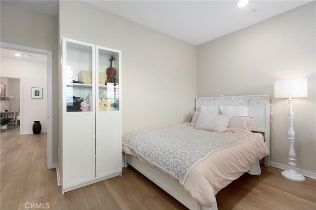 bedroom featuring light hardwood / wood-style floors