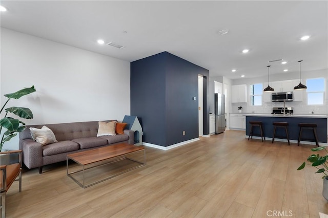 living room with light wood-type flooring