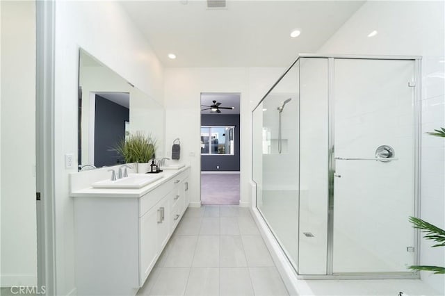 bathroom featuring vanity, tile patterned flooring, ceiling fan, and walk in shower