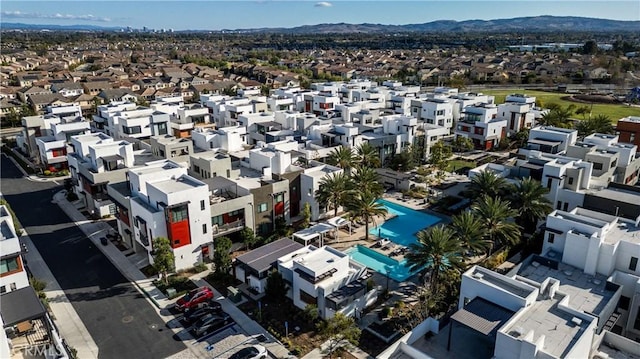 birds eye view of property with a mountain view