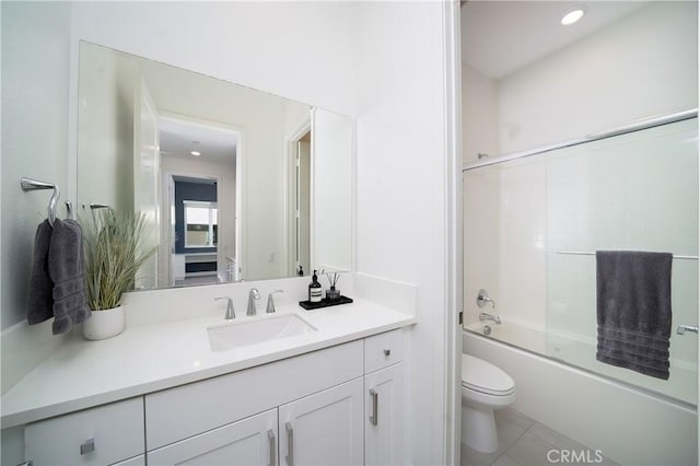 full bathroom with vanity, tile patterned floors, shower / bath combination with glass door, and toilet