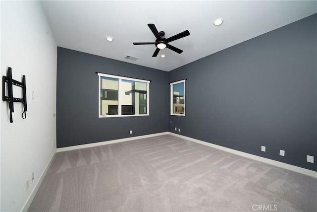 carpeted empty room with ceiling fan