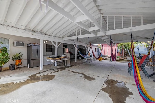 view of patio featuring a wall unit AC