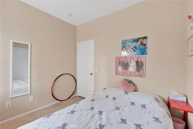 bedroom featuring carpet and baseboards