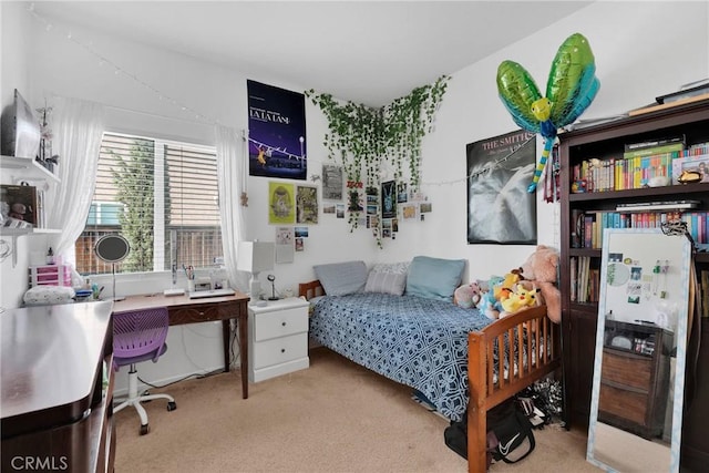 bedroom featuring light carpet