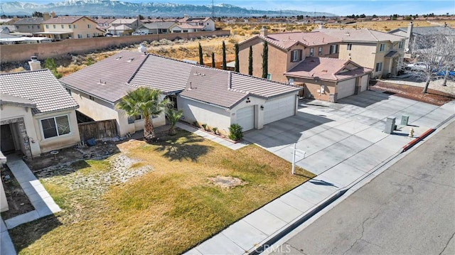 birds eye view of property with a residential view and a mountain view