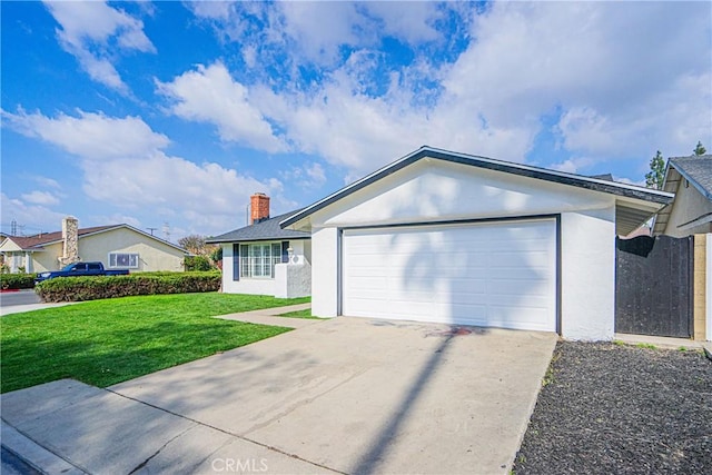 ranch-style house featuring a garage and a front yard