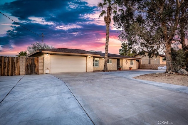 ranch-style home featuring a garage