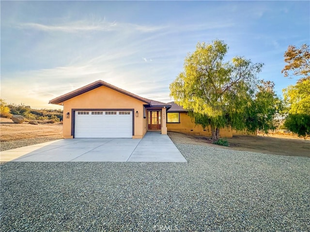 ranch-style home featuring a garage