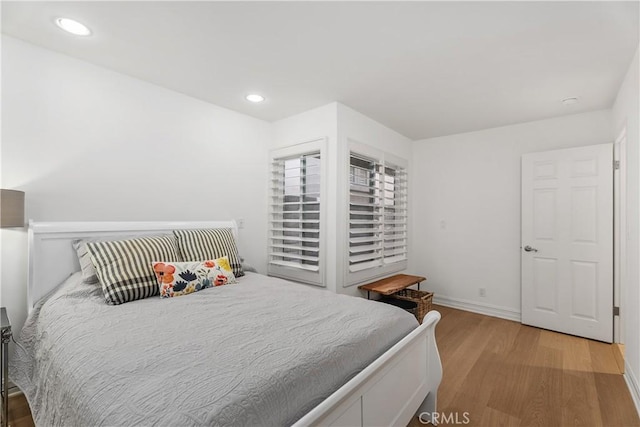 bedroom with light hardwood / wood-style flooring