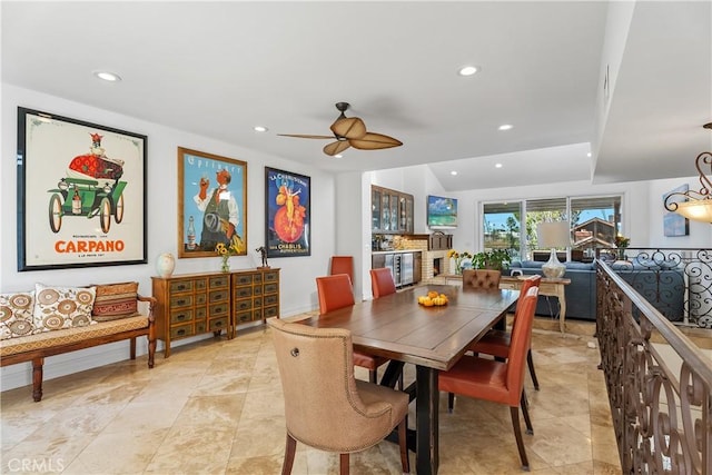 dining space featuring ceiling fan and vaulted ceiling