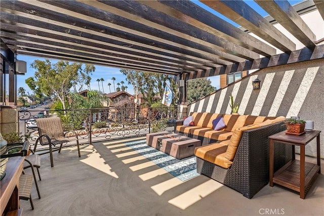 view of patio / terrace with an outdoor living space with a fire pit and a pergola