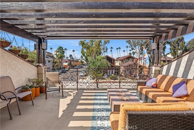 view of patio with a pergola, an outdoor hangout area, and a balcony