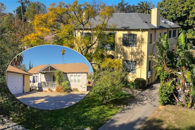 view of front of home featuring a garage, covered porch, and a front lawn