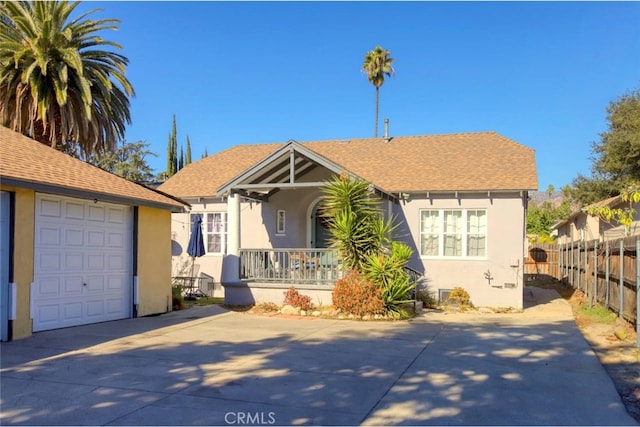 view of front facade with a garage and covered porch