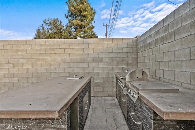 view of patio / terrace featuring an outdoor kitchen and area for grilling