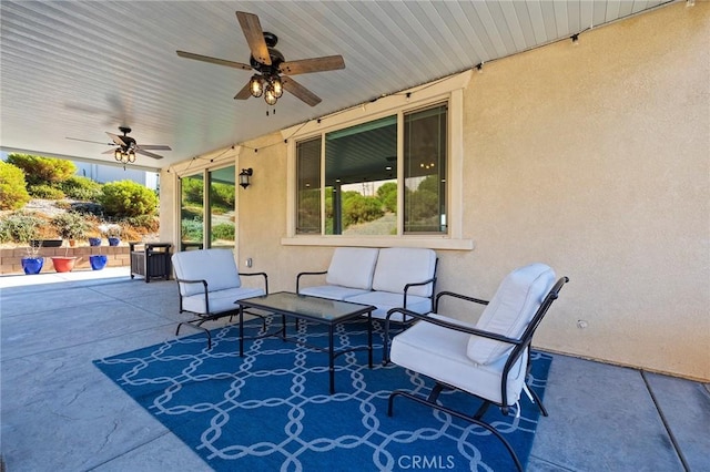 view of patio / terrace with ceiling fan and an outdoor hangout area