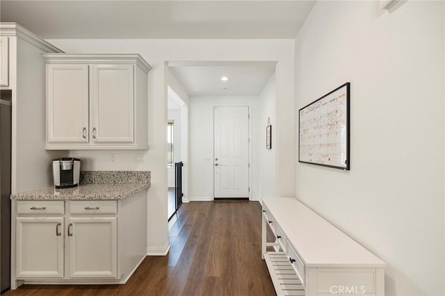 hallway featuring dark hardwood / wood-style flooring