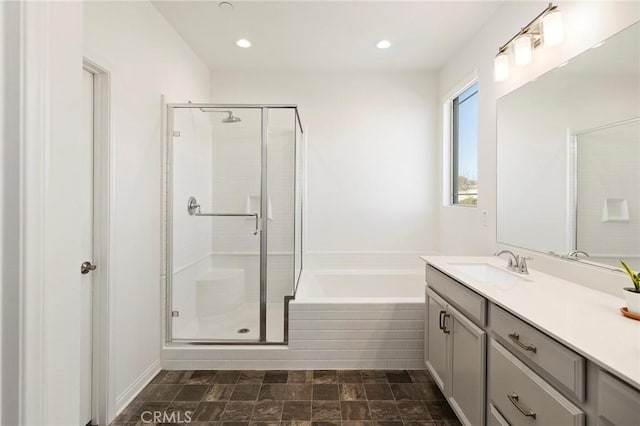 bathroom with independent shower and bath and vanity