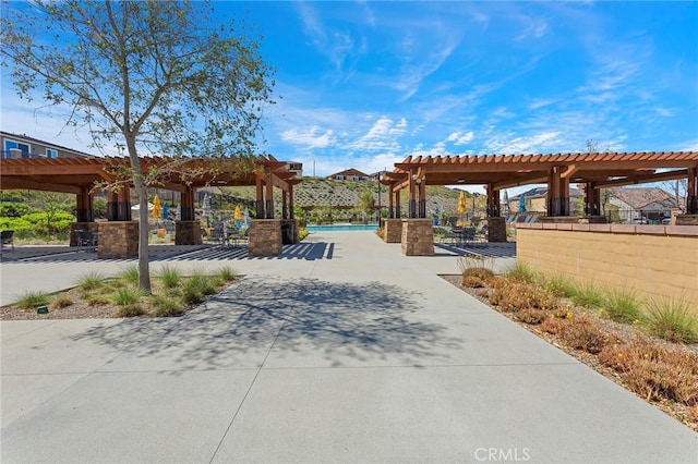 view of property's community featuring a pergola