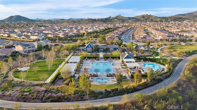 birds eye view of property with a mountain view